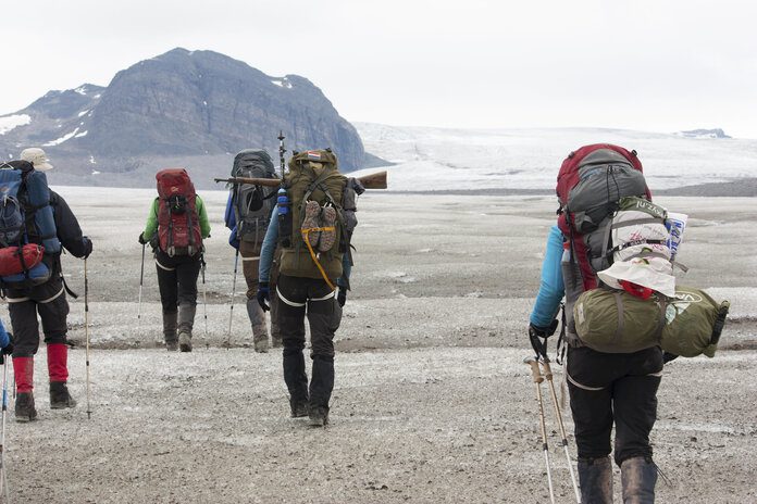 hikers using poles to prevent swollen hands