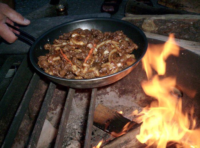 cooking on a pan on pitfire