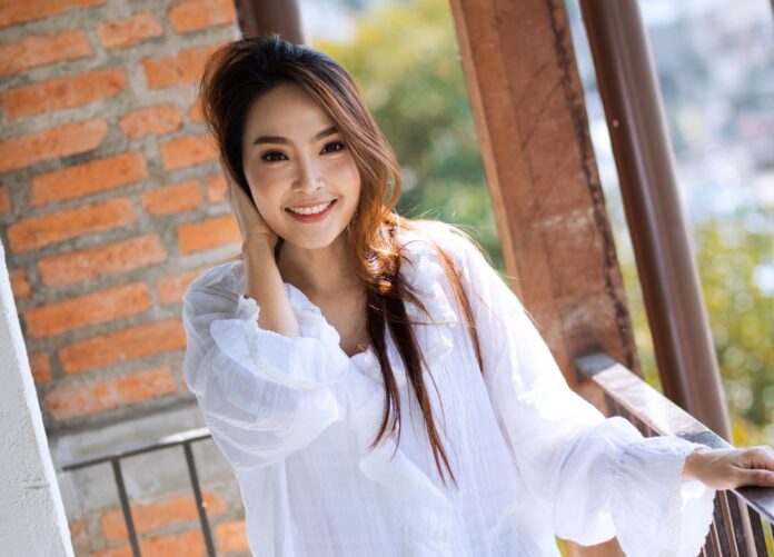 Young confident Thai woman don't mind relationship with foreign men