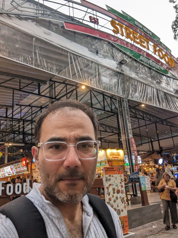 Outside the lively Ben Nghe street food market Ho Chi Minh City